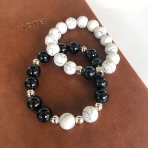His & Hers Love Earth bracelets.